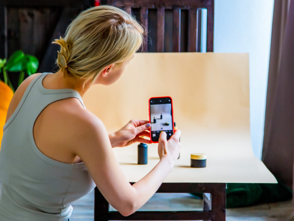 Woman taking photos of product for social media marketing